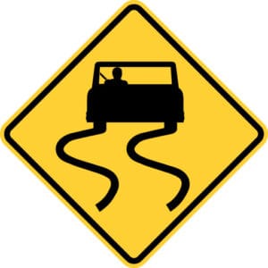 Slippery when wet road sign