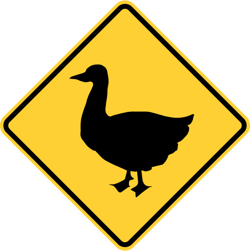 duck crossing road sign